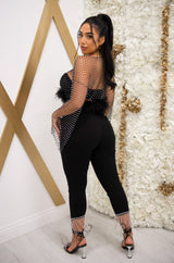 High rise skinny jeans with rhinestone fringe hem in black