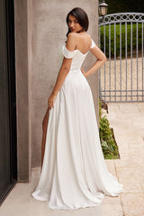 A simple sweetheart neckline gathers around the waistline, flowing into a light slitted skirt.