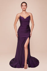 fitted dress features a strapless pointed V-neckline, gathered waistline, and a chic leg slit