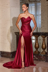 evening gown with a thigh-high slit and dramatic draped side sash