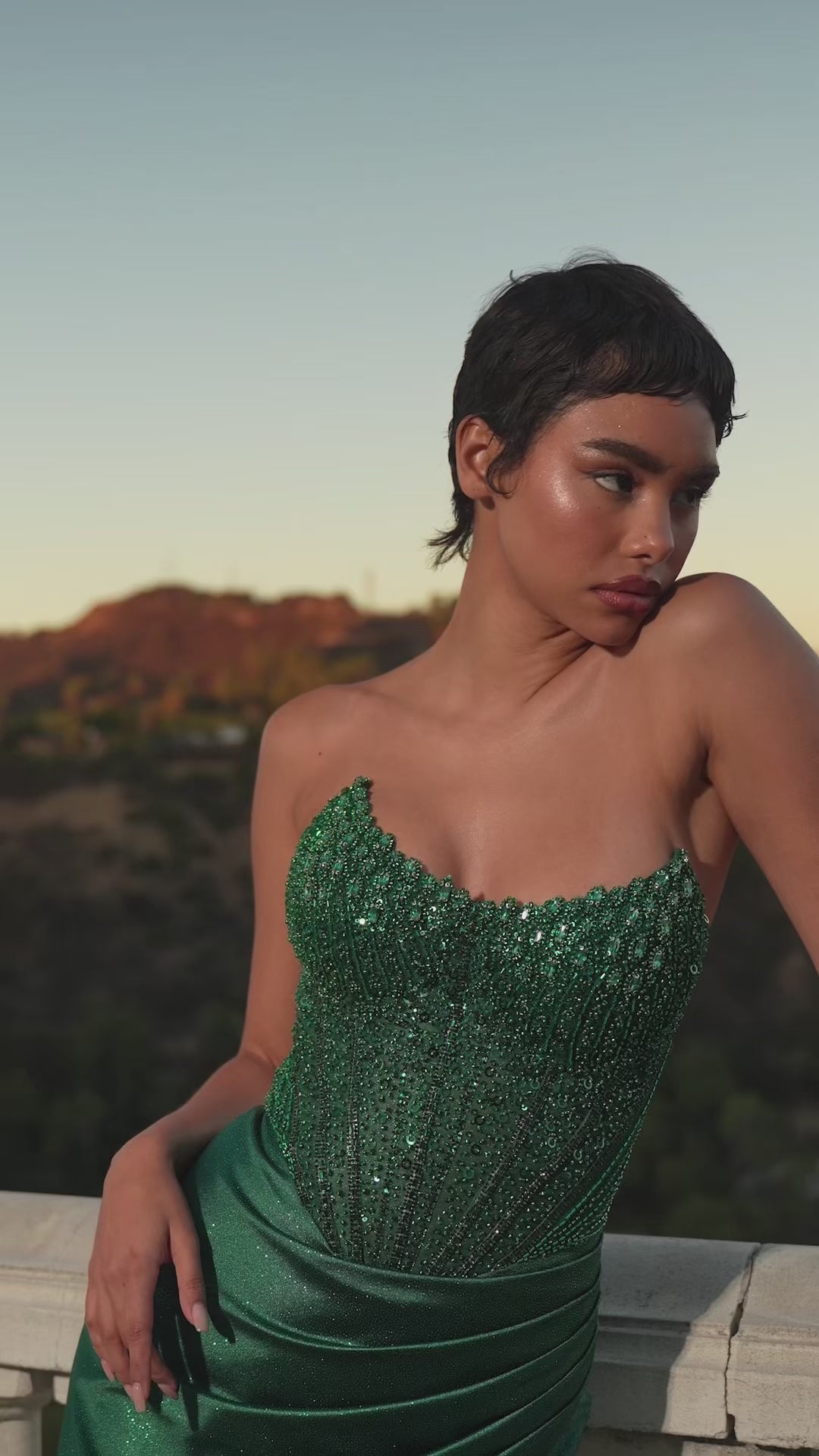 fitted strapless gown showcases a scoop neckline and a dazzling embellished corset bodice that radiates elegance