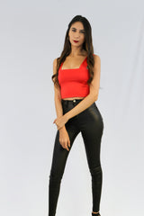 Tight cropped tank top in red.