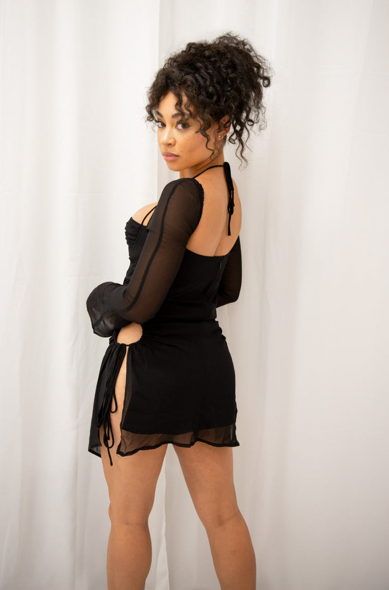 Mini dress with adjustable side cutouts, long mesh sleeves, adjustable front tie, halter neck and zipper back