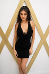 Halter mini dress with low curtain neckline, criss cross back and pearl detail in black