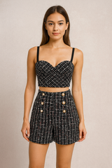 Black tweed push up bustier paired with a matching tweed high waisted shorts.