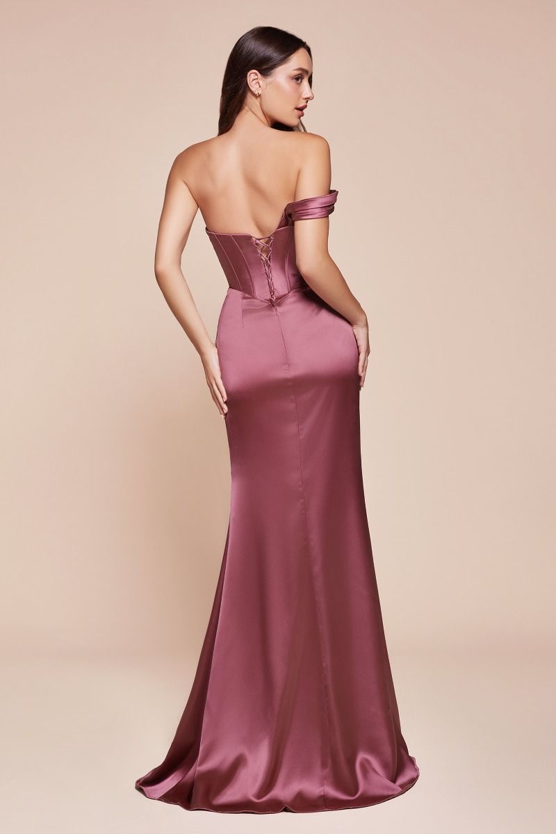 fitted gown showcases a one-shoulder pleated neckline with a gathered waistline and a leg slit