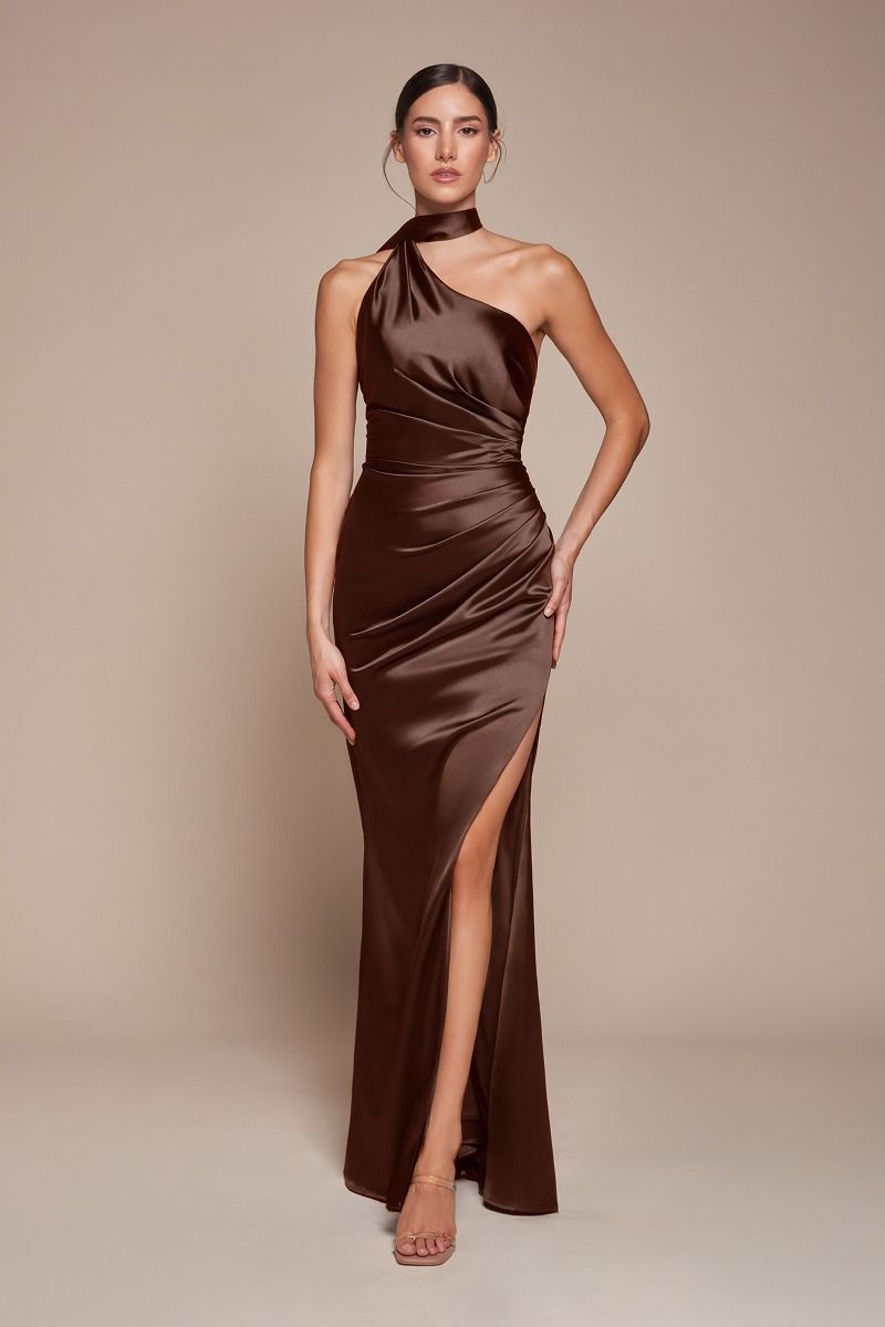 itted gown showcases a chic one-shoulder wrap halter neckline, with a gathered waistline and elegant leg slit