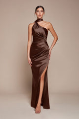 itted gown showcases a chic one-shoulder wrap halter neckline, with a gathered waistline and elegant leg slit