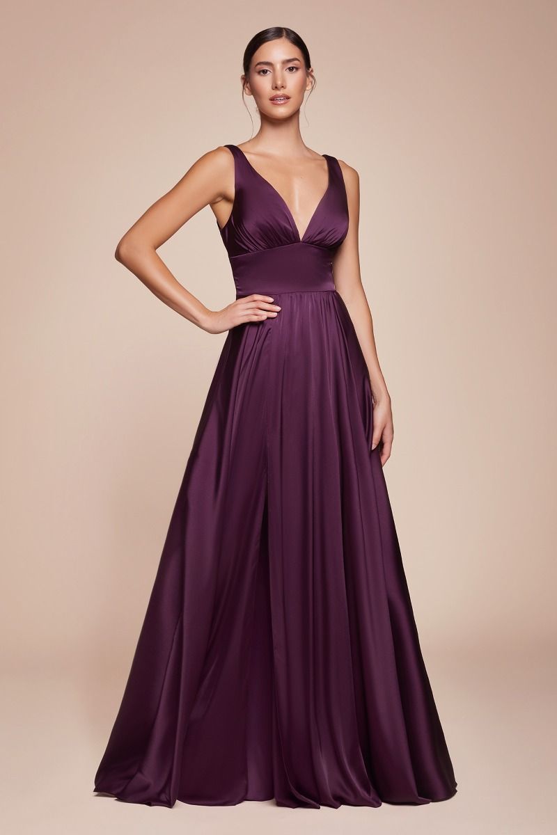 A-line dress features a deep V-neckline and an empire waistline