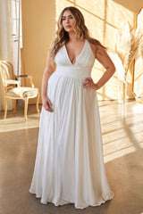 A-line dress features a deep V-neckline and an empire waistline