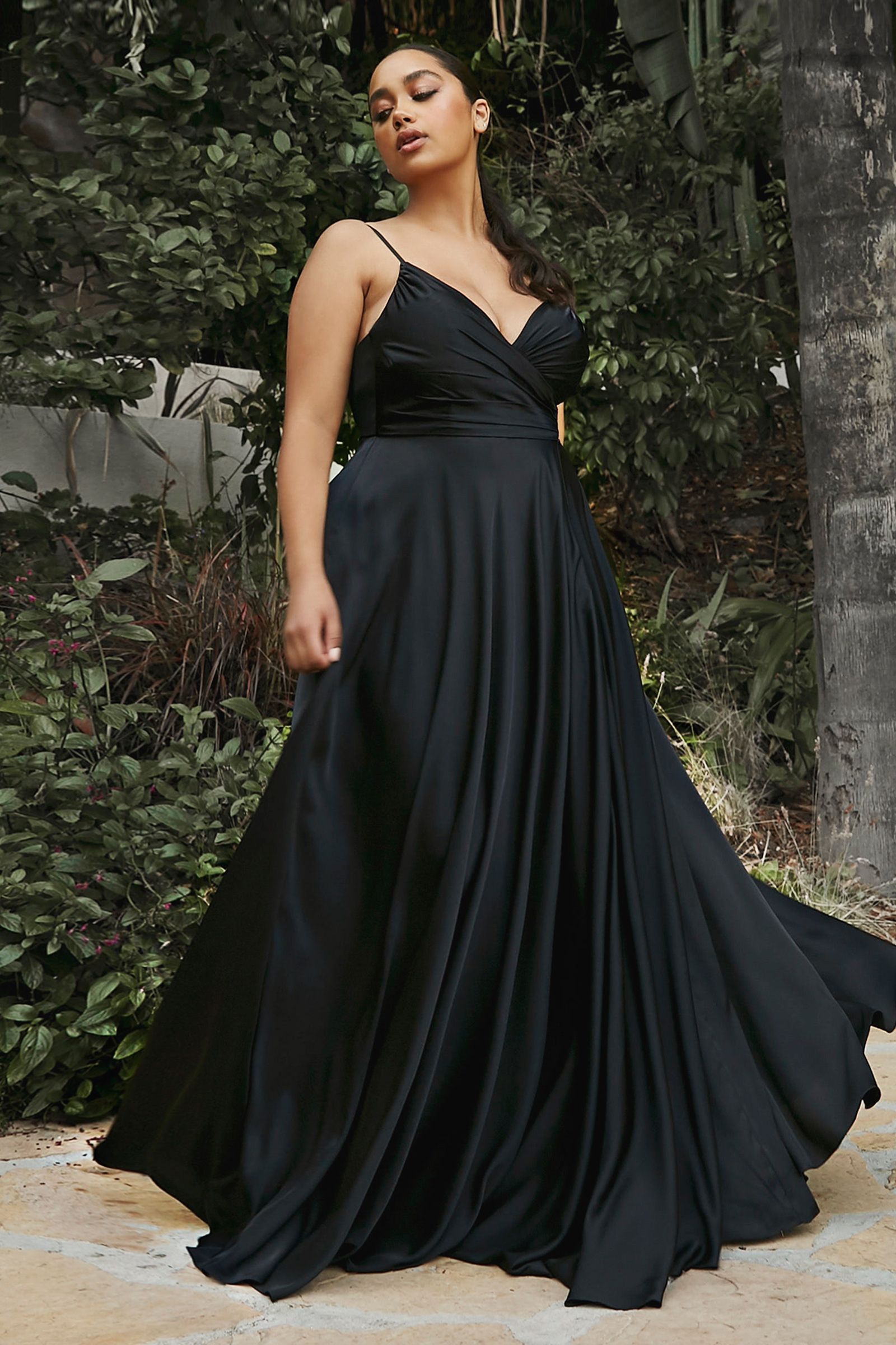 this dress features a sweetheart neckline and a flowy skirt with an elegant leg opening