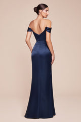 Navy blue off-shoulder evening gown on a beige background