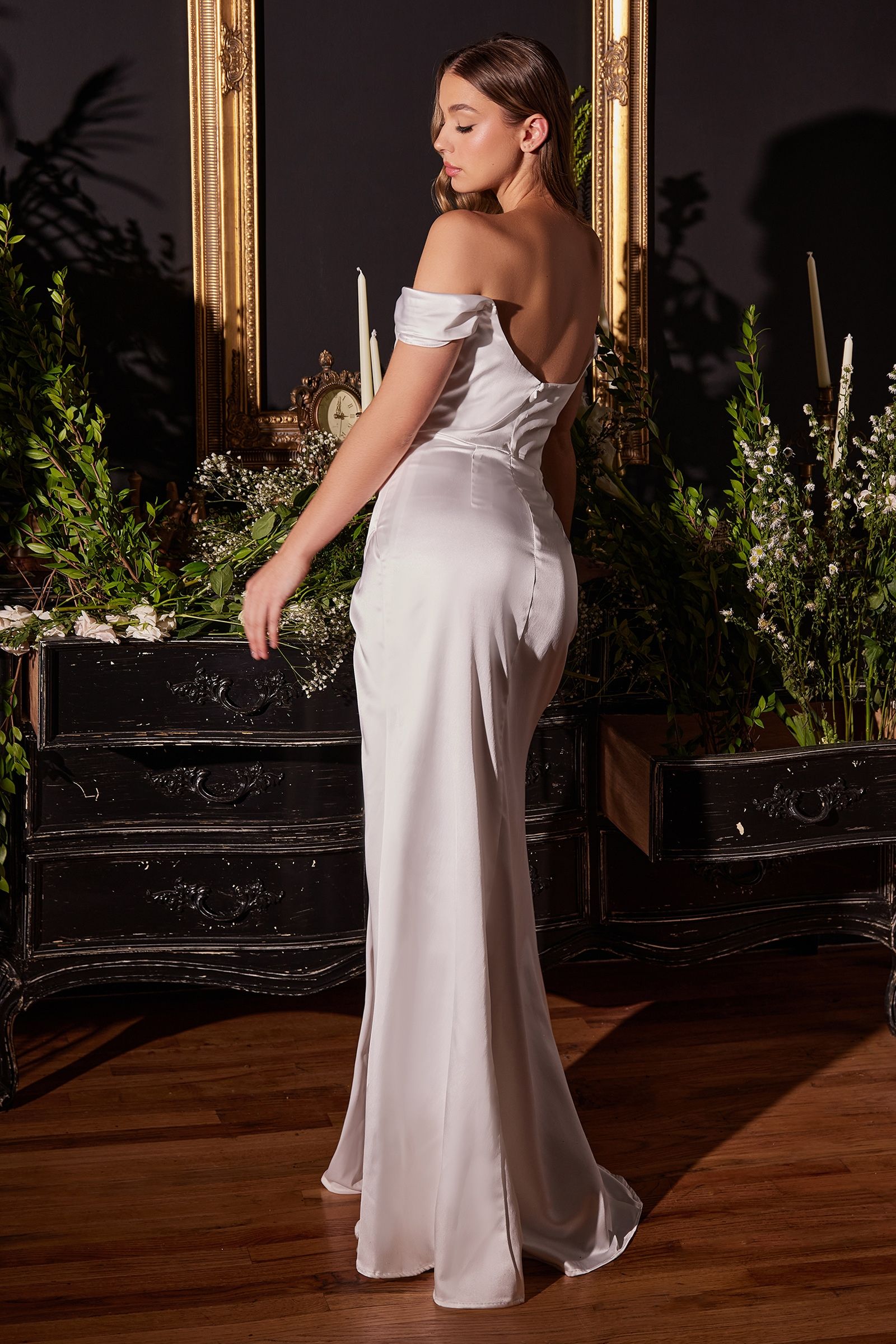 structured boned bodice is draped with a cowl neckline