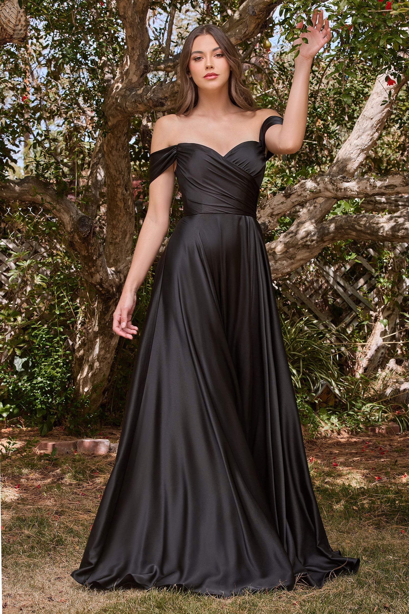 A simple sweetheart neckline gathers around the waistline, flowing into a light slitted skirt