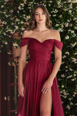 A simple sweetheart neckline gathers around the waistline, flowing into a light slitted skirt