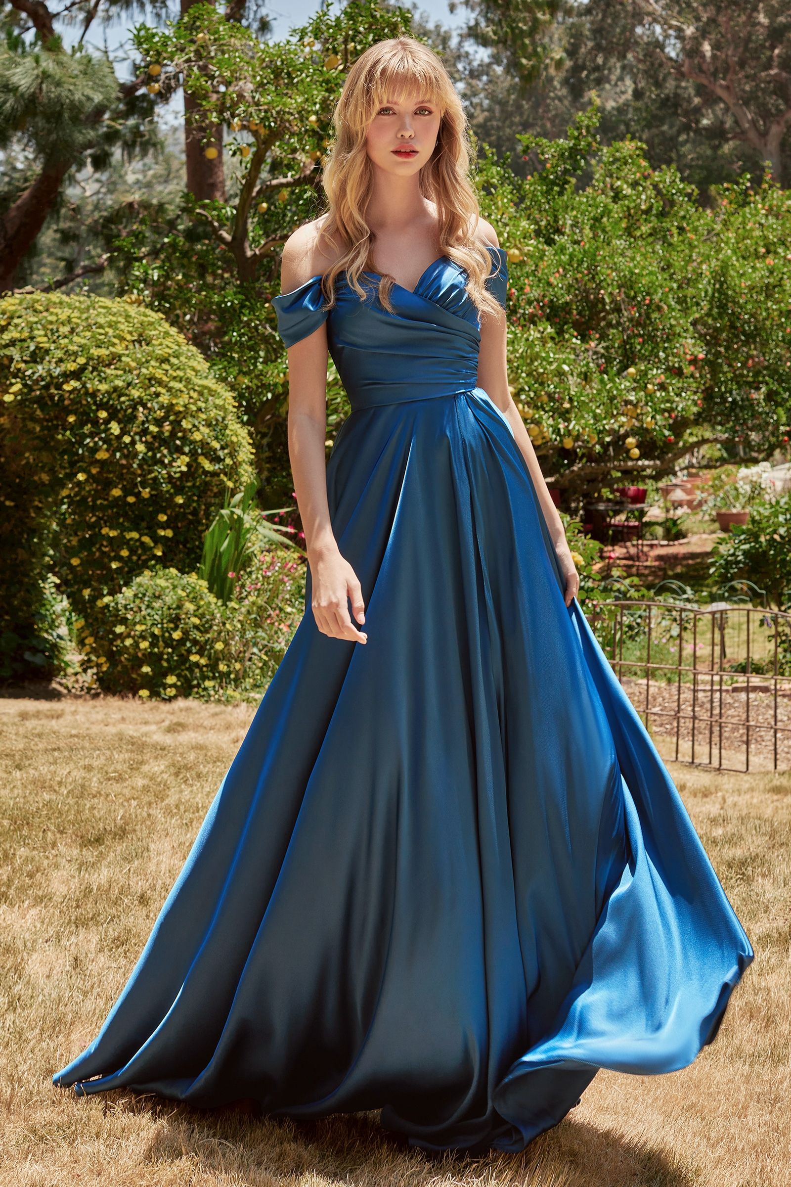 A simple sweetheart neckline gathers around the waistline, flowing into a light slitted skirt