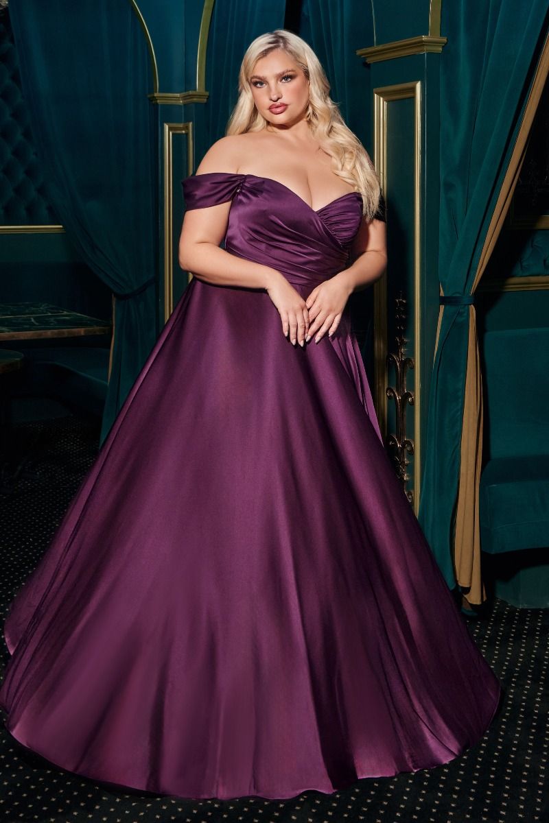 A simple sweetheart neckline gathers around the waistline, flowing into a light slitted skirt