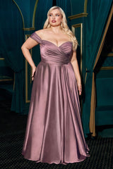 A simple sweetheart neckline gathers around the waistline, flowing into a light slitted skirt