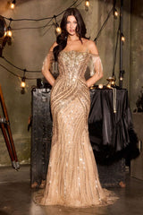 Woman in a sparkling gold evening gown standing in a stylishly decorated room with string lights.
