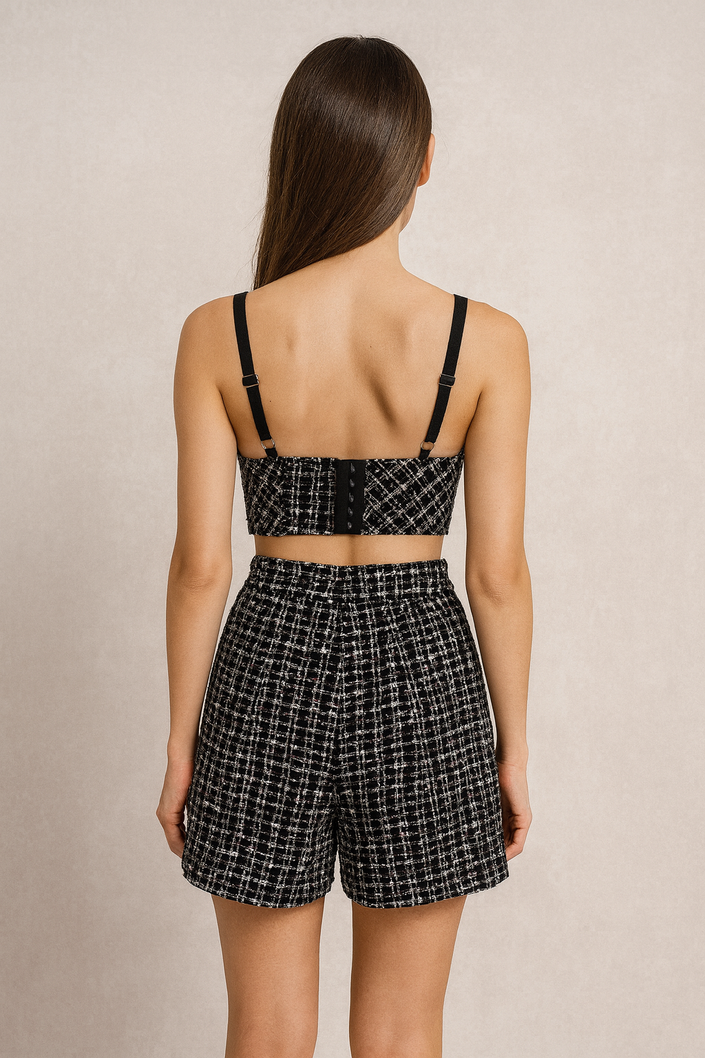 Black tweed push up bustier paired with a matching tweed high waisted shorts.