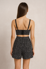 Black tweed high waisted shorts paired with a tweed push up bustier.