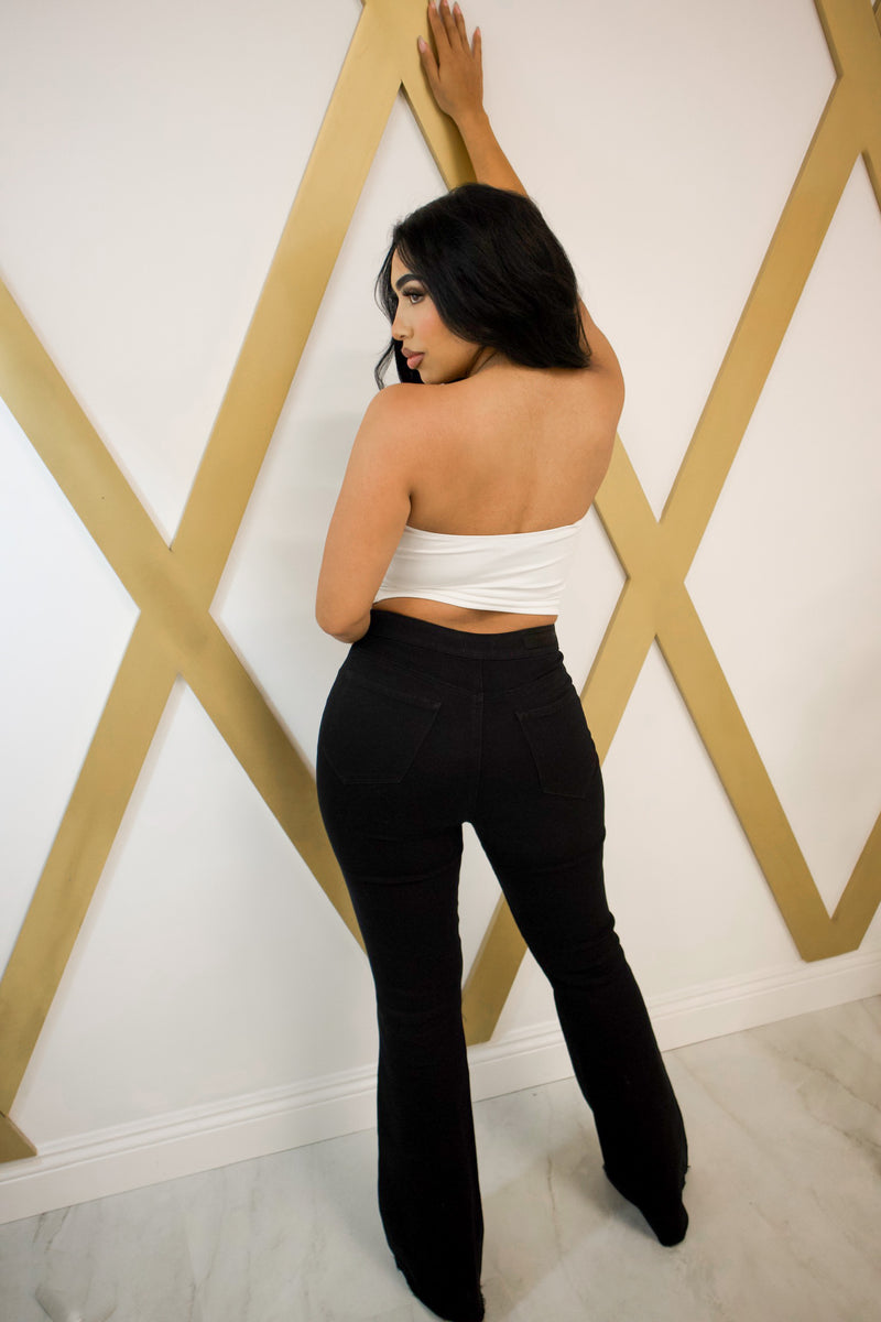 High waisted flare pants with bottom distress in black
