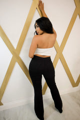 High waisted flare pants with bottom distress in black
