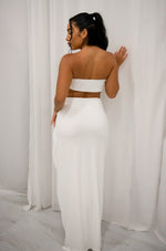 Strapless bandeu with gold metal detail and matching high slit maxi skirt