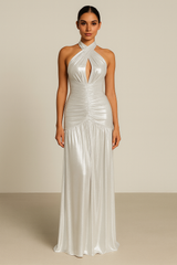 Metallic halter maxi dress with a front keyhole cutout, ruched detailing down the bodice, open tie-back, and a floor-length draped hem.
