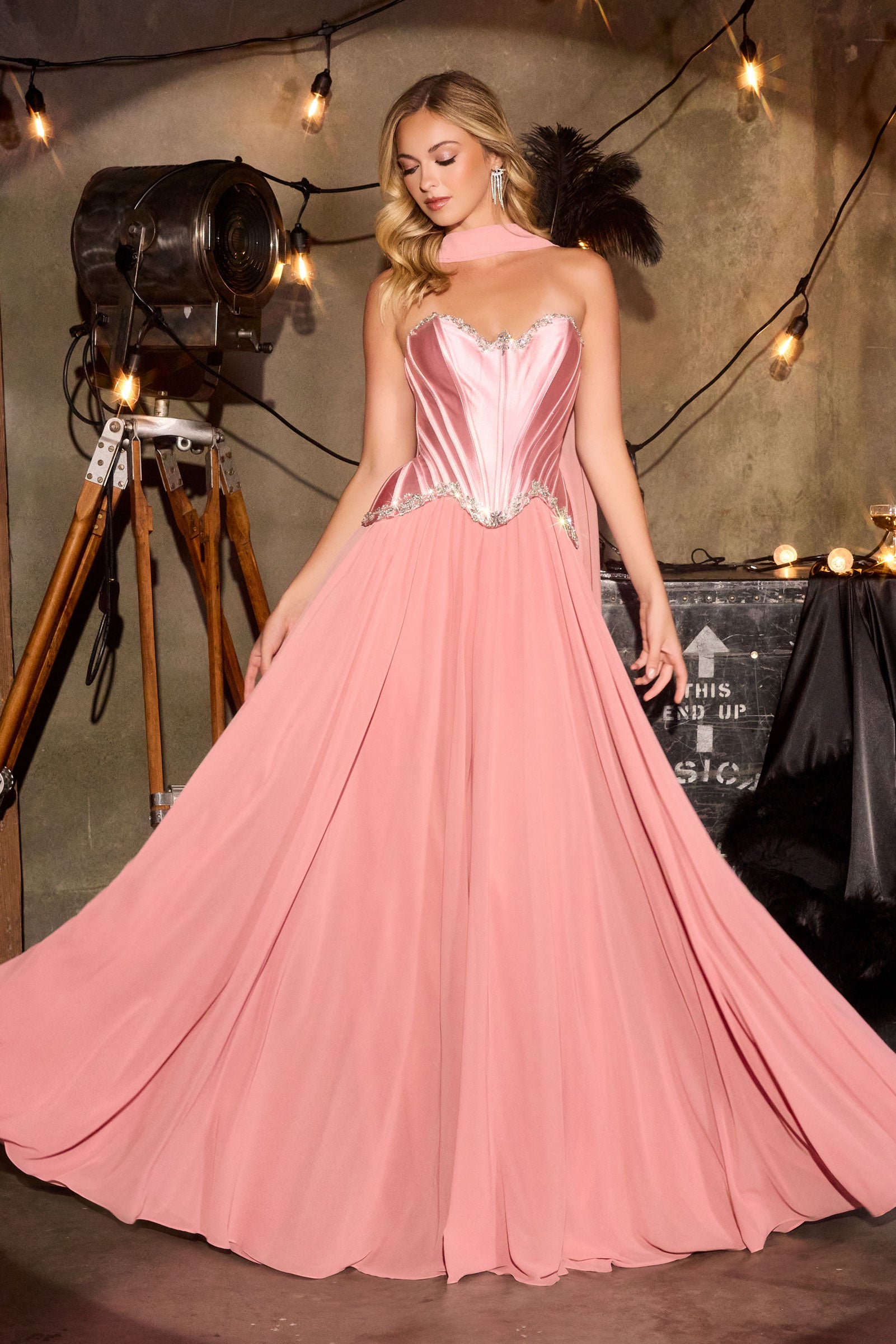 sculpted satin corset bodice, it features delicate crystal embellishments that trace along the neckline and waist