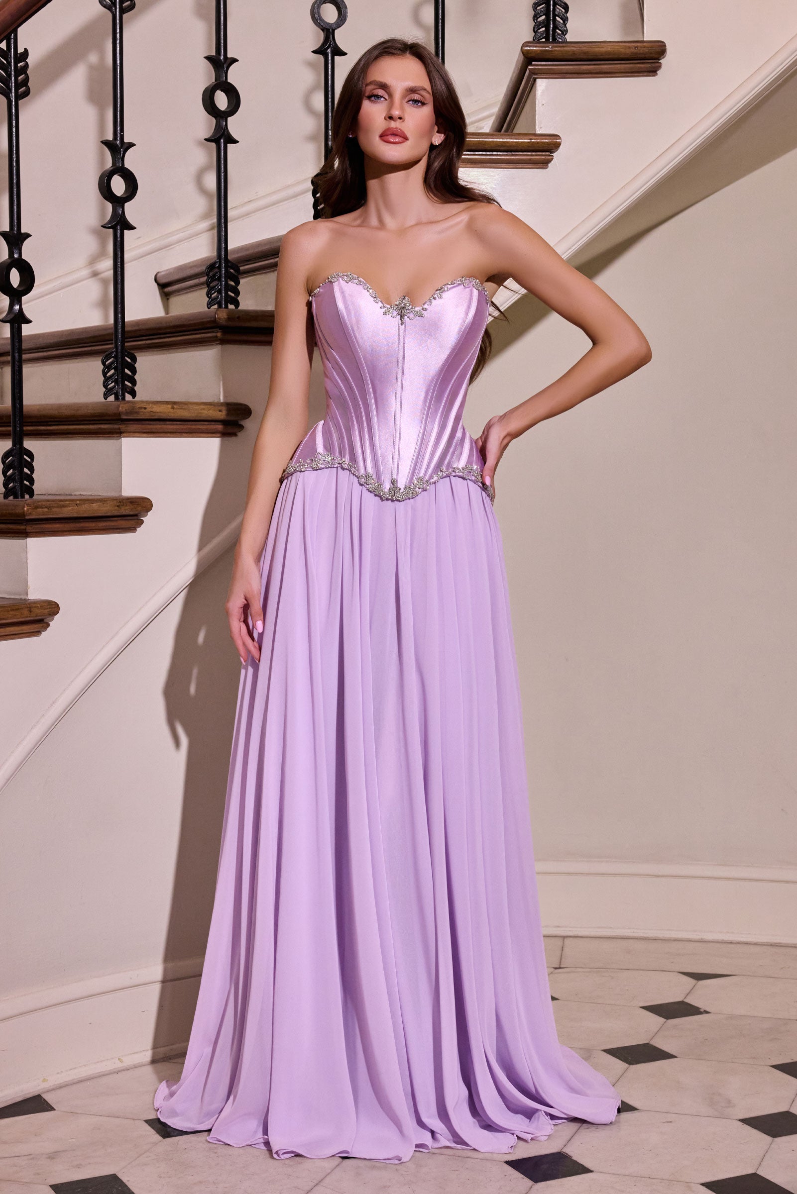 sculpted satin corset bodice, it features delicate crystal embellishments that trace along the neckline and waist