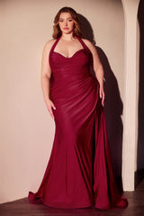 Woman wearing a burgundy evening gown against a neutral background