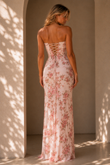Strapless floral corset maxi dress with a lace-up back and thigh-high slit.