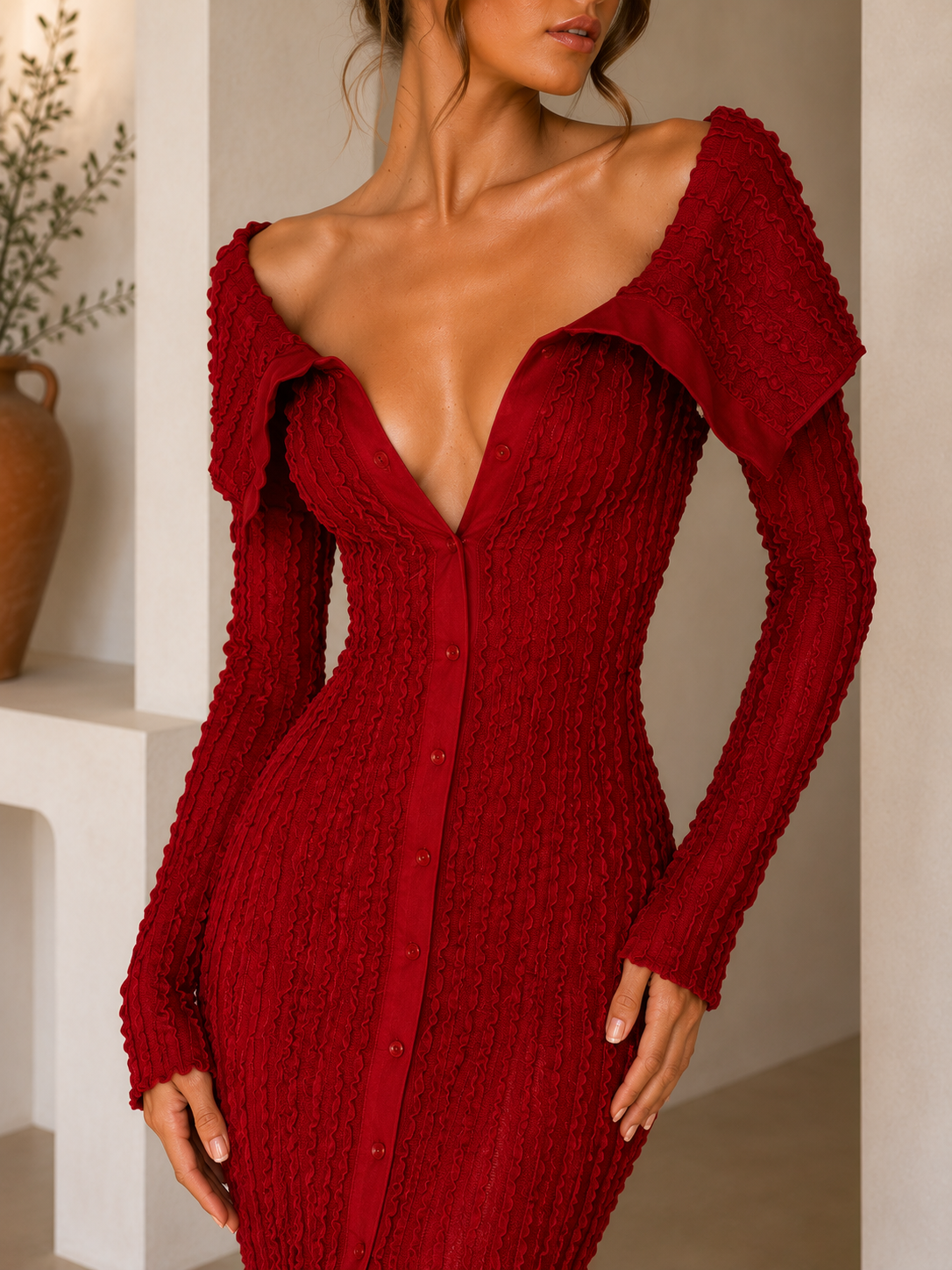 Off-the-shoulder textured bodycon maxi dress with long sleeves, button-front detail, and a front slit.