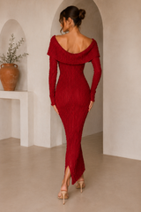 Off-the-shoulder textured bodycon maxi dress with long sleeves, button-front detail, and a front slit.