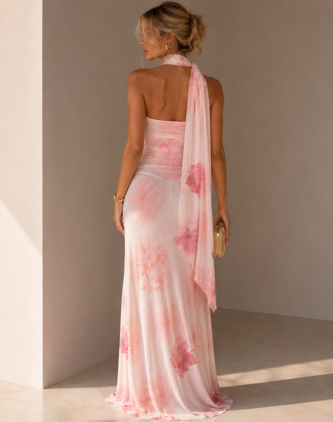 Floral ruched maxi dress with an asymmetric scarf neckline and flowing scarf detail.