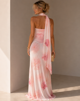 Floral ruched maxi dress with an asymmetric scarf neckline and flowing scarf detail.
