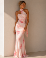 Floral ruched maxi dress with an asymmetric scarf neckline and flowing scarf detail.