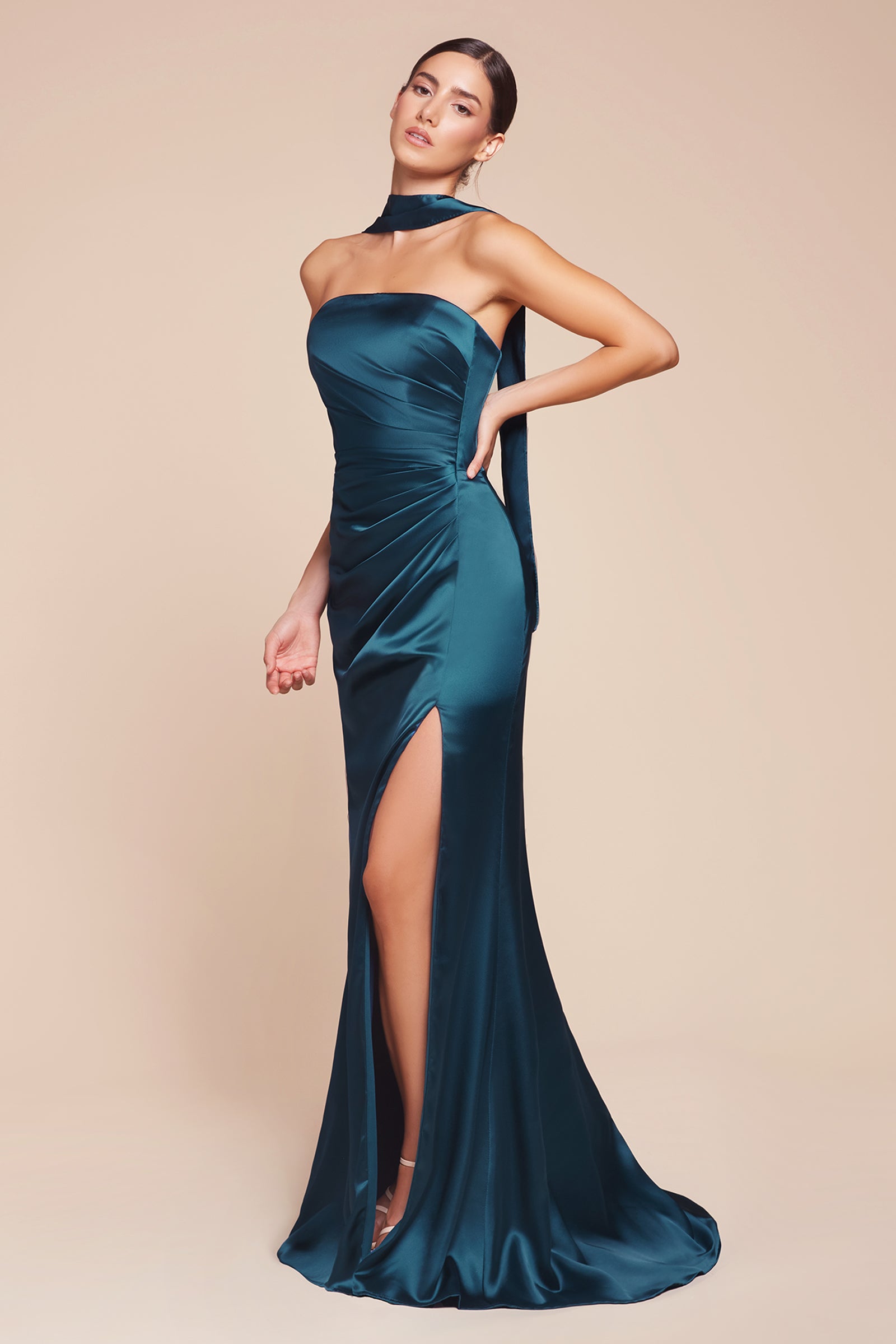 fitted strapless gown, crafted from luxe satin, features a sleek straight neckline, gathered waistline, and elegant leg slit