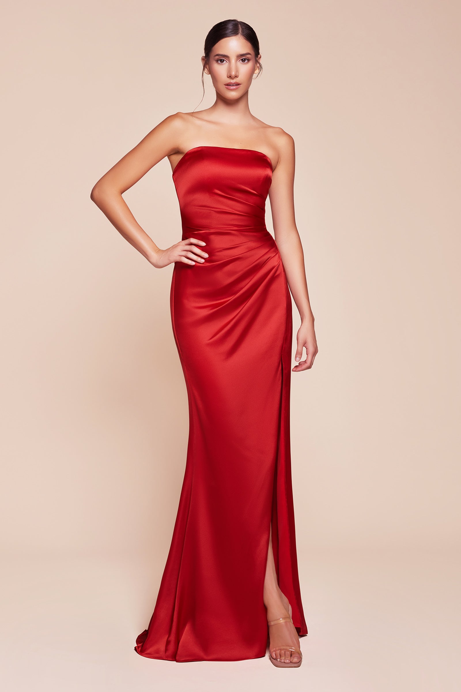 fitted strapless gown, crafted from luxe satin, features a sleek straight neckline, gathered waistline, and elegant leg slit