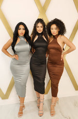 Satin bodycon midi dress with halter neck that ties, low back, and back slit in black, chocolate, silver