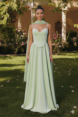 girl standing in sage gown 