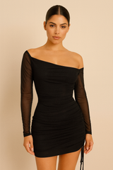 one-shoulder mini dress featuring a sheer long sleeve, fitted ruched detailing throughout, and an adjustable side drawstring,