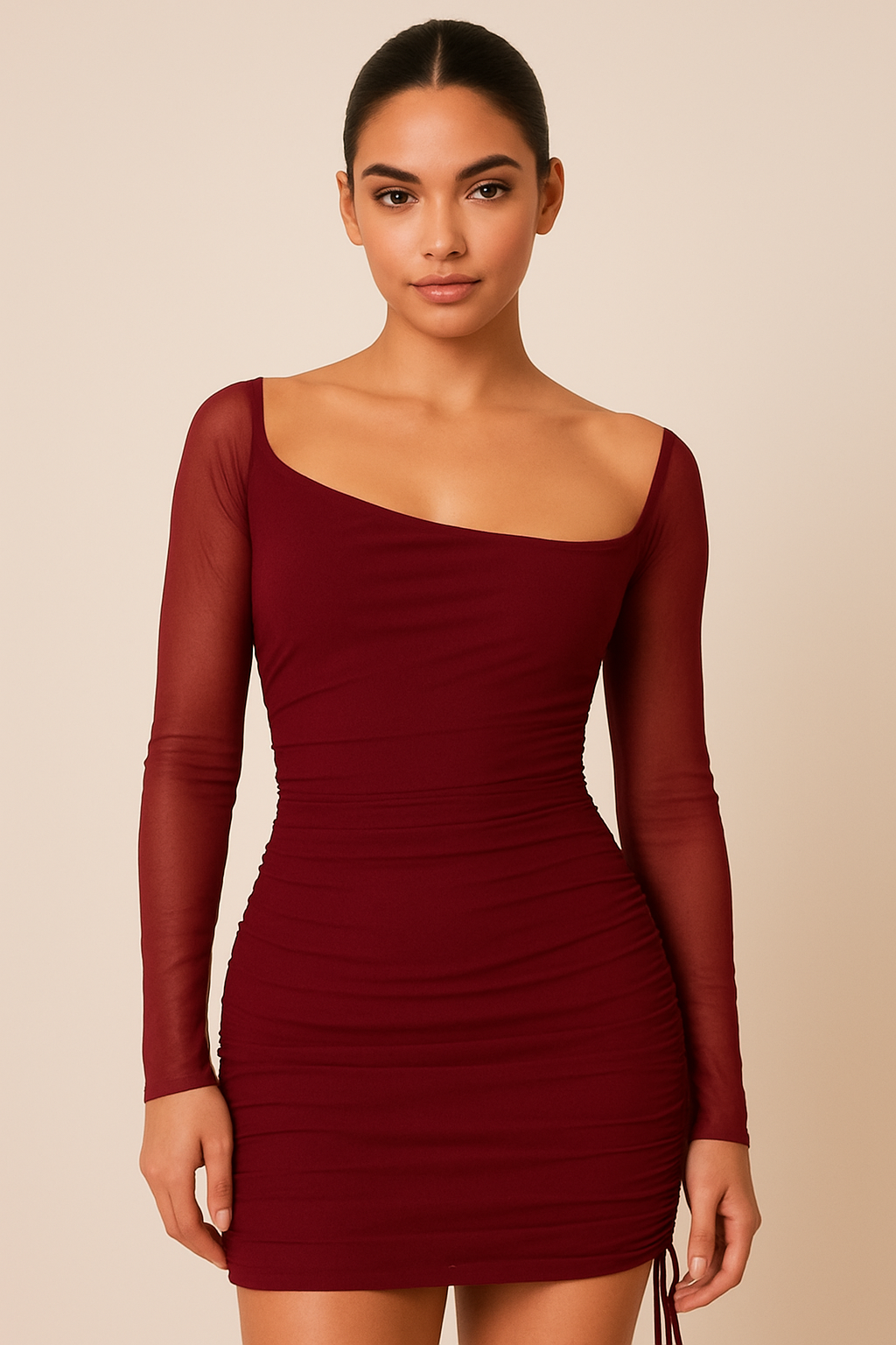 one-shoulder mini dress featuring a sheer long sleeve, fitted ruched detailing throughout, and an adjustable side drawstring,