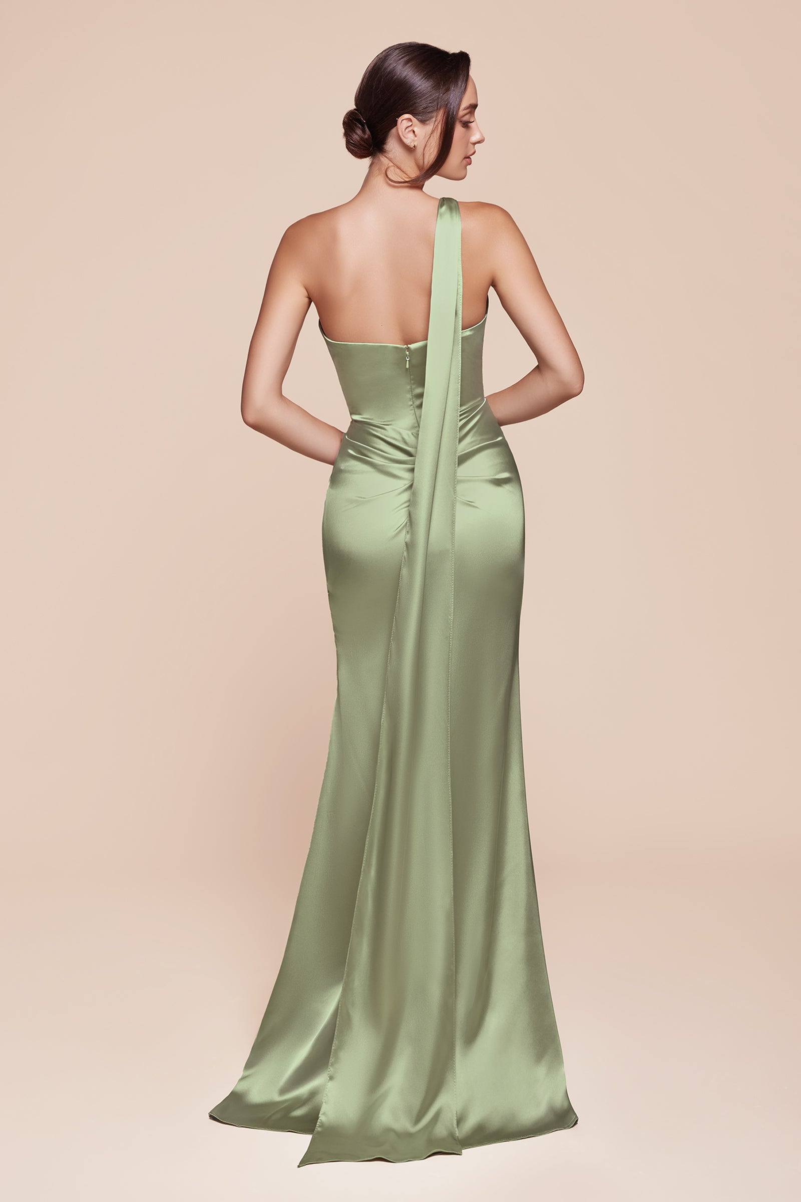 This fitted gown showcases a chic one-shoulder wrap halter neckline, with a gathered waistline and elegant leg slit for added allure