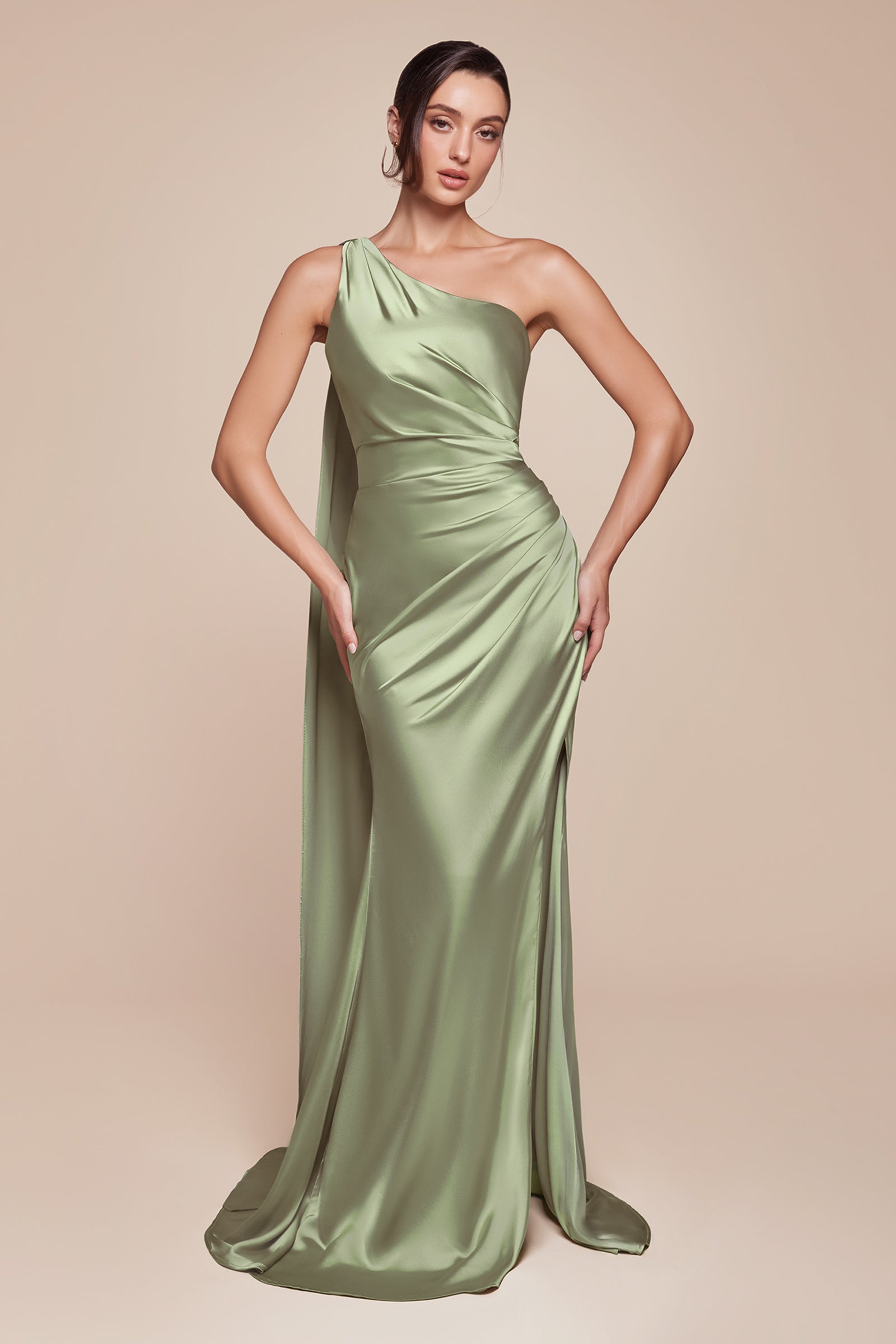 This fitted gown showcases a chic one-shoulder wrap halter neckline, with a gathered waistline and elegant leg slit for added allure