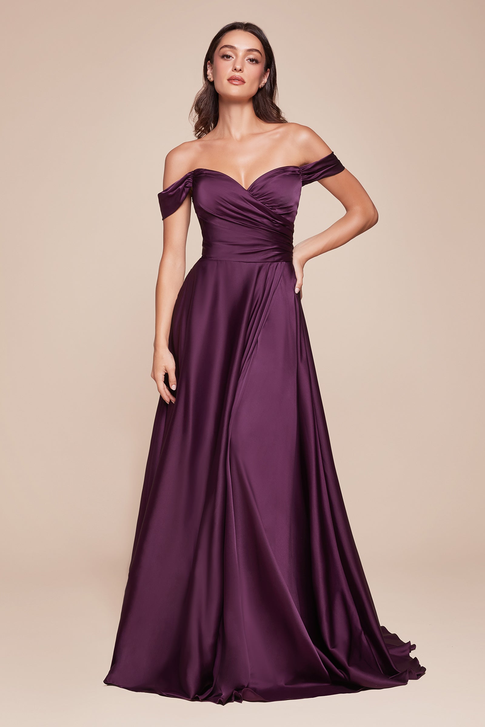 A simple sweetheart neckline gathers around the waistline, flowing into a light slitted skirt