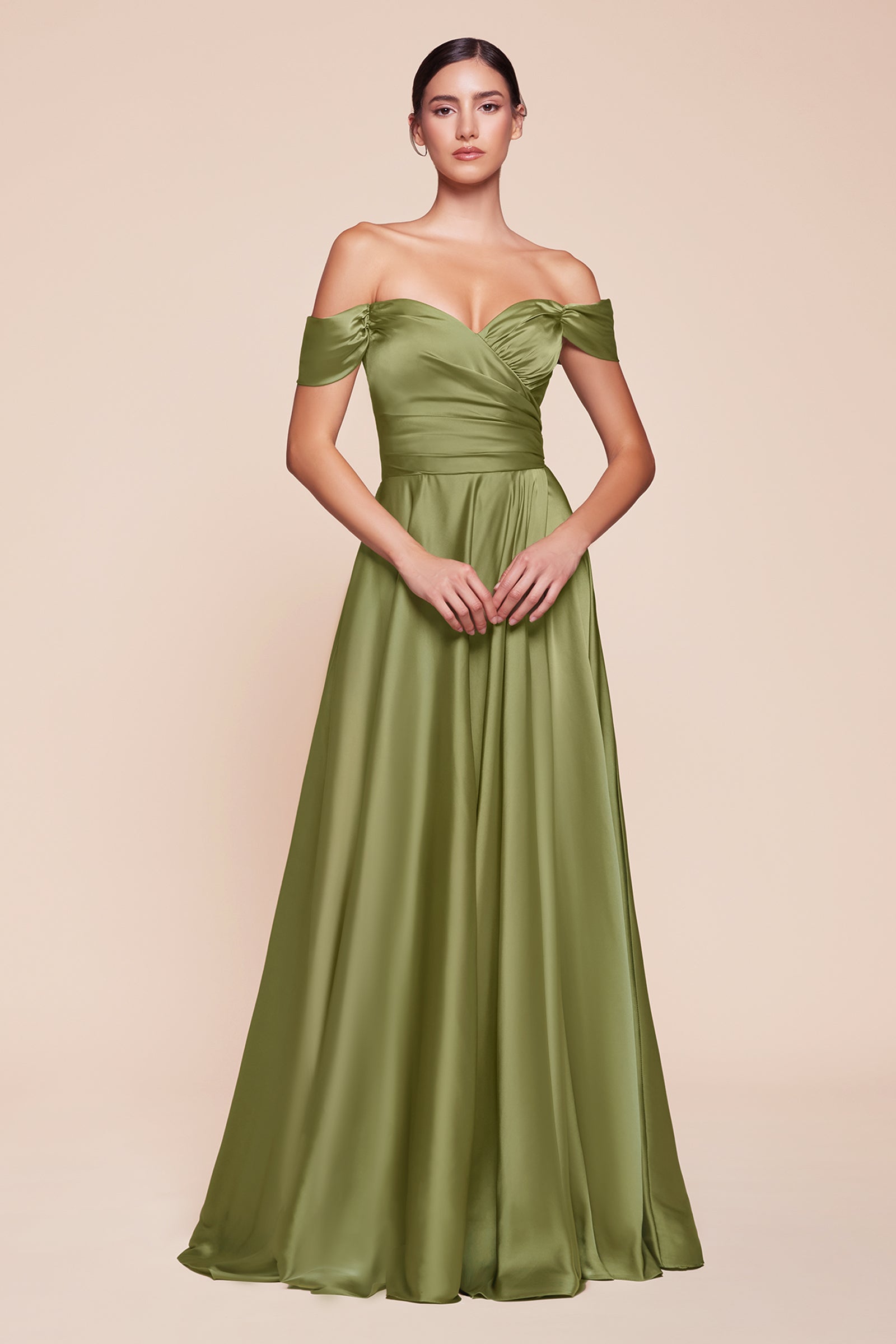 A simple sweetheart neckline gathers around the waistline, flowing into a light slitted skirt