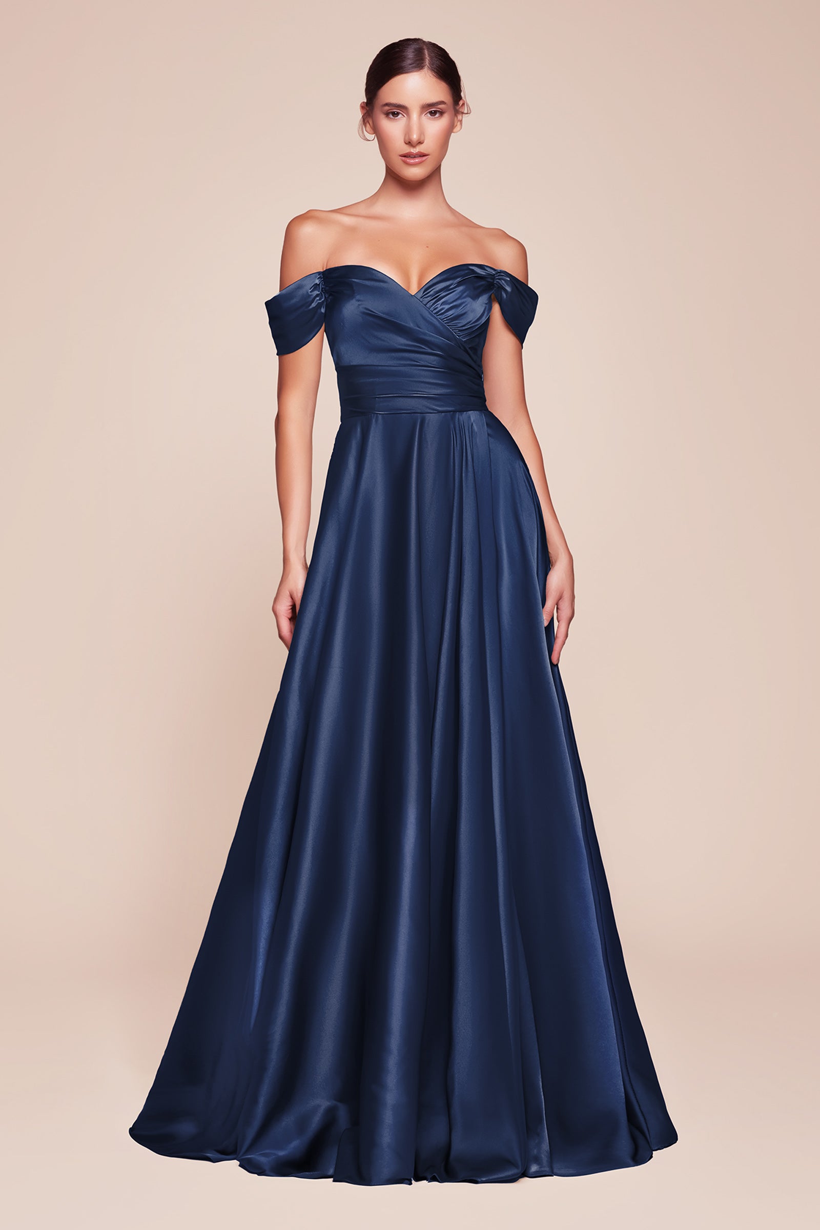 A simple sweetheart neckline gathers around the waistline, flowing into a light slitted skirt