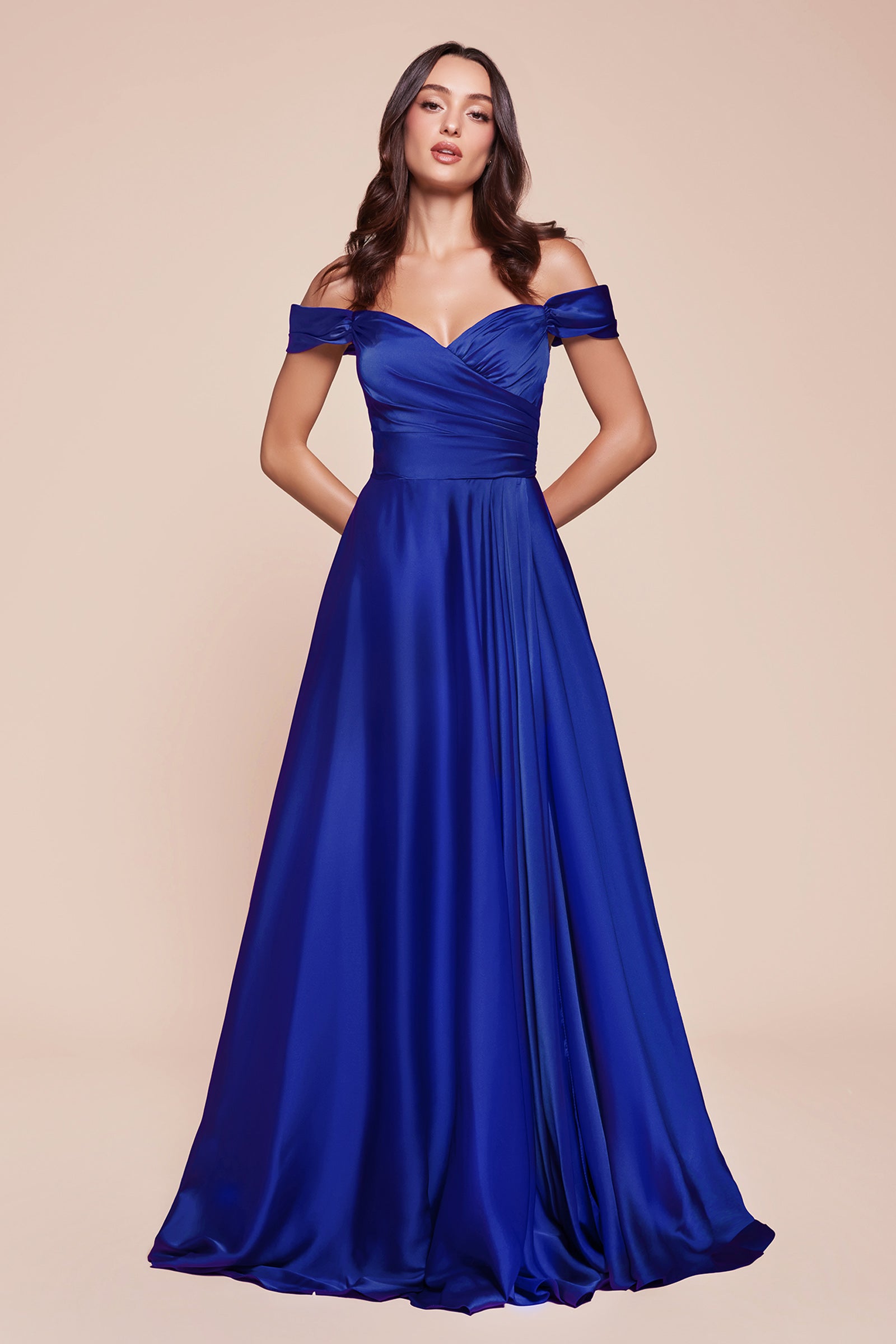 A simple sweetheart neckline gathers around the waistline, flowing into a light slitted skirt